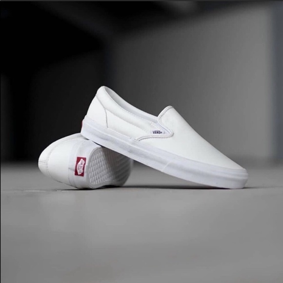 tumble slip on white vans